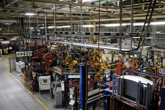 Modern factory with machinery, storage systems, and organized warehouse for efficient logistics operations