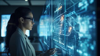 Frau, die ein futuristisches Glas-Touch-Display bedient – Symbol für Innovation und Zukunftstechnologie